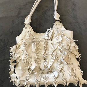 Carlos Santana white purse